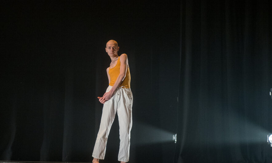 Person on stage dancing.
