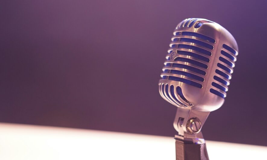 Silver microphone on a stage.
