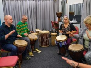 People playing drums together.