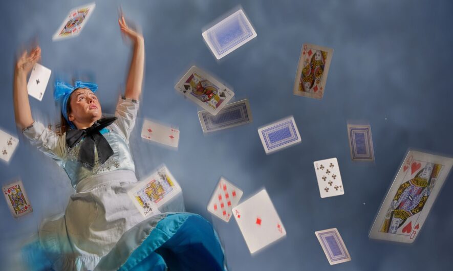 Alice is falling through a blue smokey background, several playing cards fall with her of various suits and numbers.
