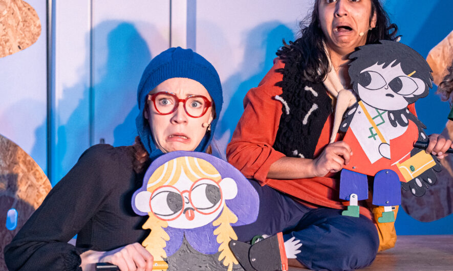 Two little vikings stand on stage looking scared.