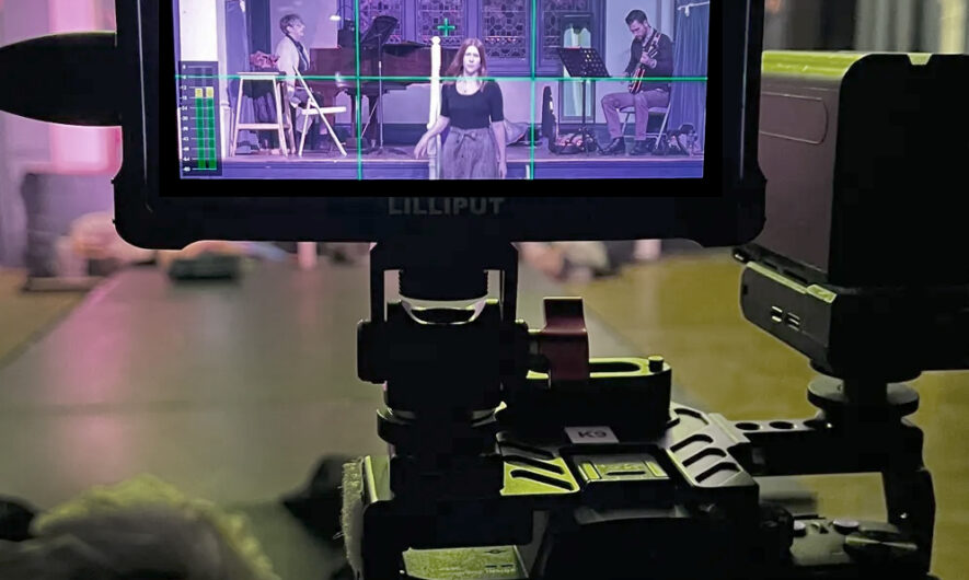 Behind the scenes shot of film camera recording.