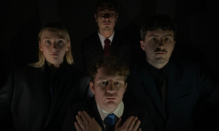 Promotional image for student Cabaret, 4 actors face forward, wearing smart clothes against a dark background